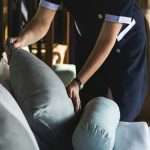 Housekeeper cleaning a hotel room