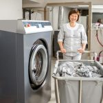 Senior washwoman in the laundry